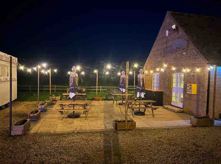 stanton-village-club-garden-at-night-with-lights-sideon